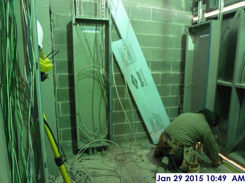 Installing panel boards at the 1st floor Electrical Room Facing East